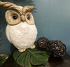 Wicker rattan decorative balls on table top with owl